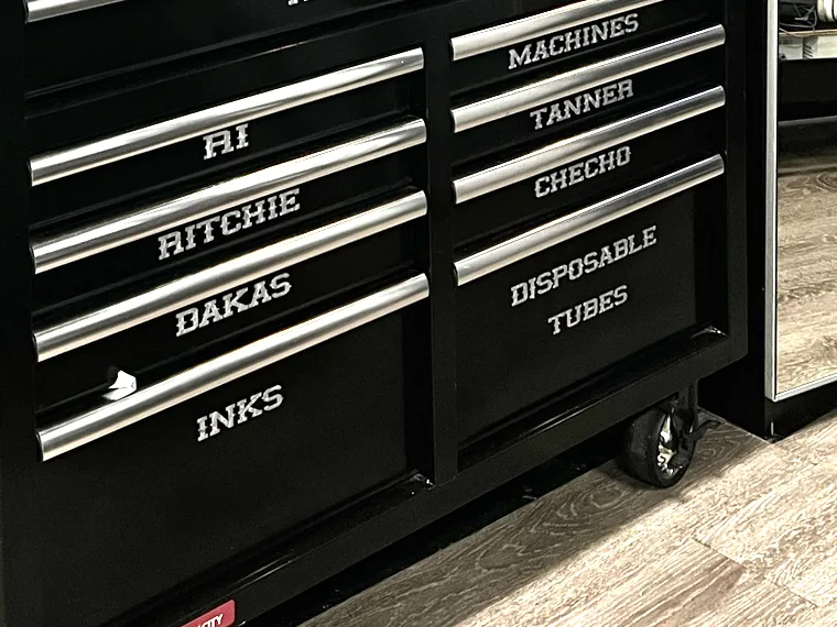 A tool chest with a drawer labelled for each artist